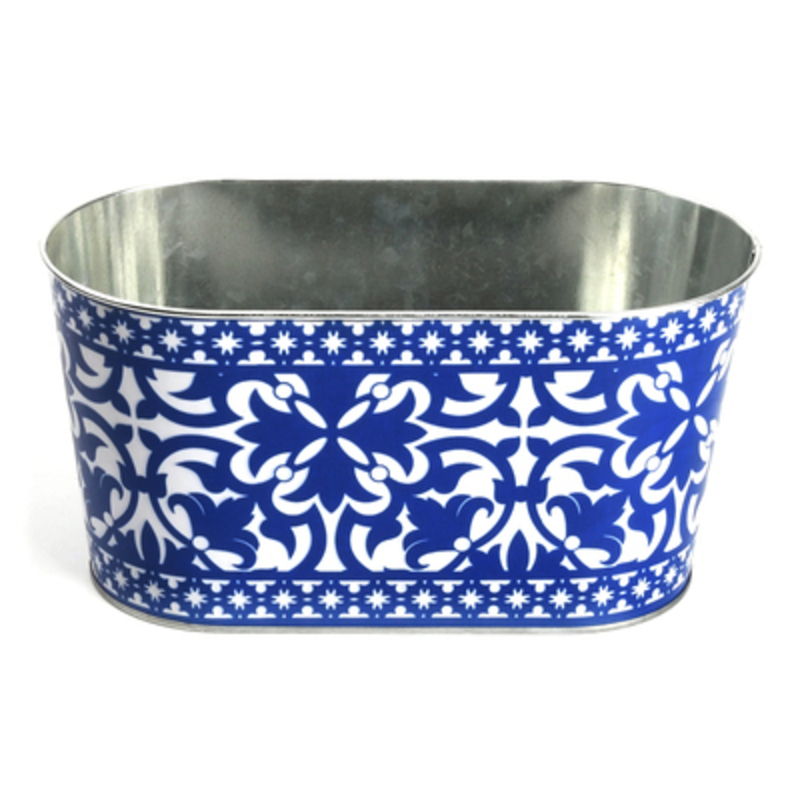 Fallen Fruits Blue and White Portuguese Oval Planter Metal oval planter with blue and white Portuguese design. Made by Fallen Fruits. This stylish planter would look lovely inside or outside.  The beautiful blue and white design will add atmosphere to any home or garden whilst providing a space for a variety of plants to grow. Size: 24.4 x 12.8 x 10.5cm
